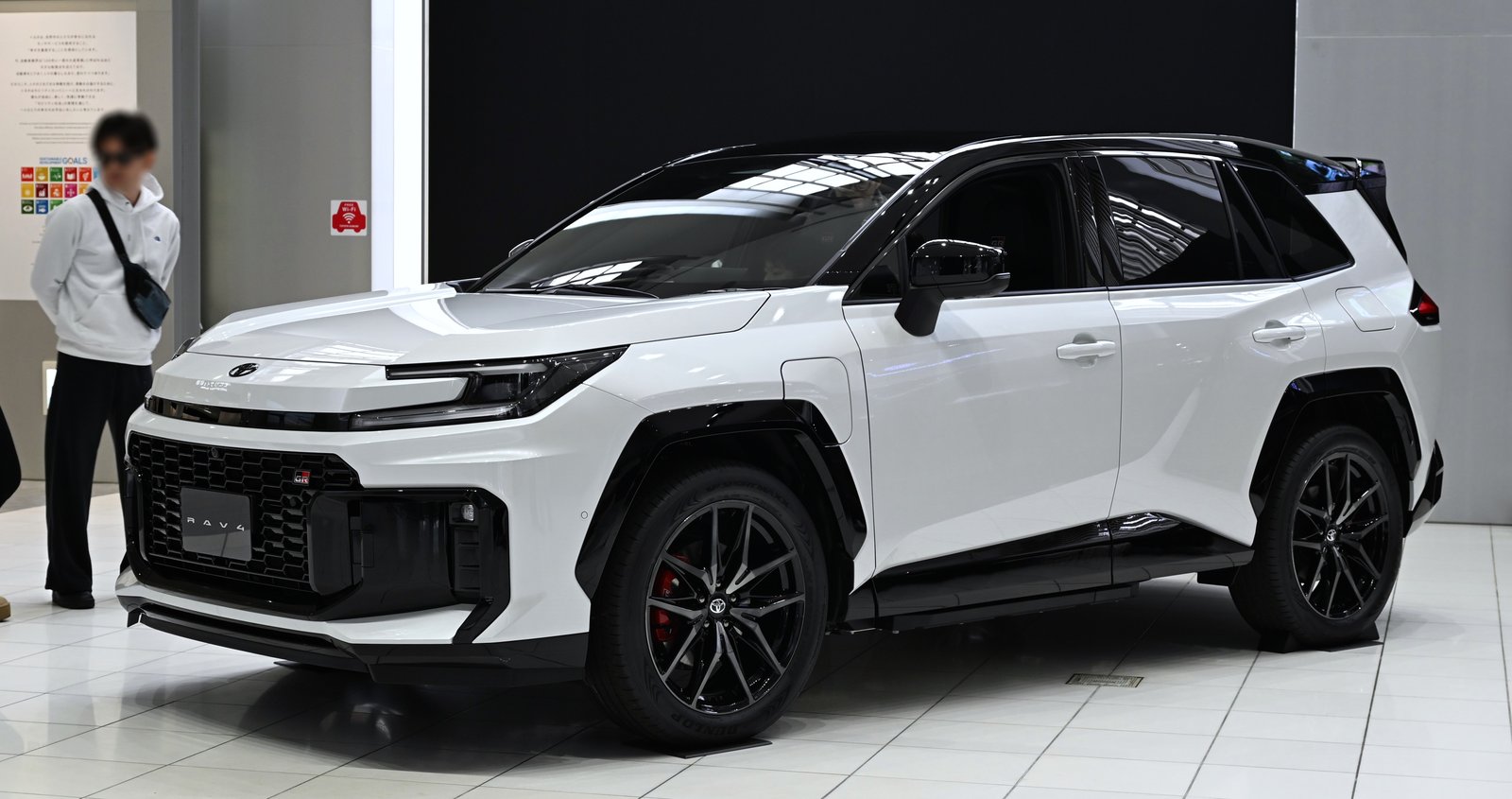 2026 Toyota RAV4 in red, front three-quarter view, shown in PHEV GR Sport form